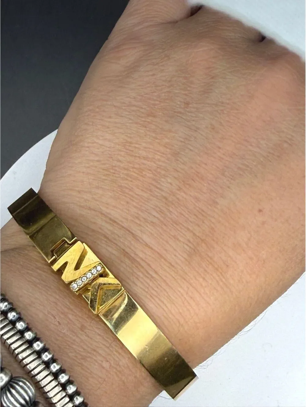Michael Kors Gold Tone Steel MK Logo Pavé Crystal Hinged Bangle Bracelet